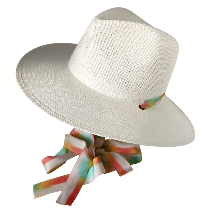 Khia Tullae The Billie white toquilla straw wide-brim hat with multicolor pastel rainbow silk drop-down ribbon, angled product cutout with ribbon detail