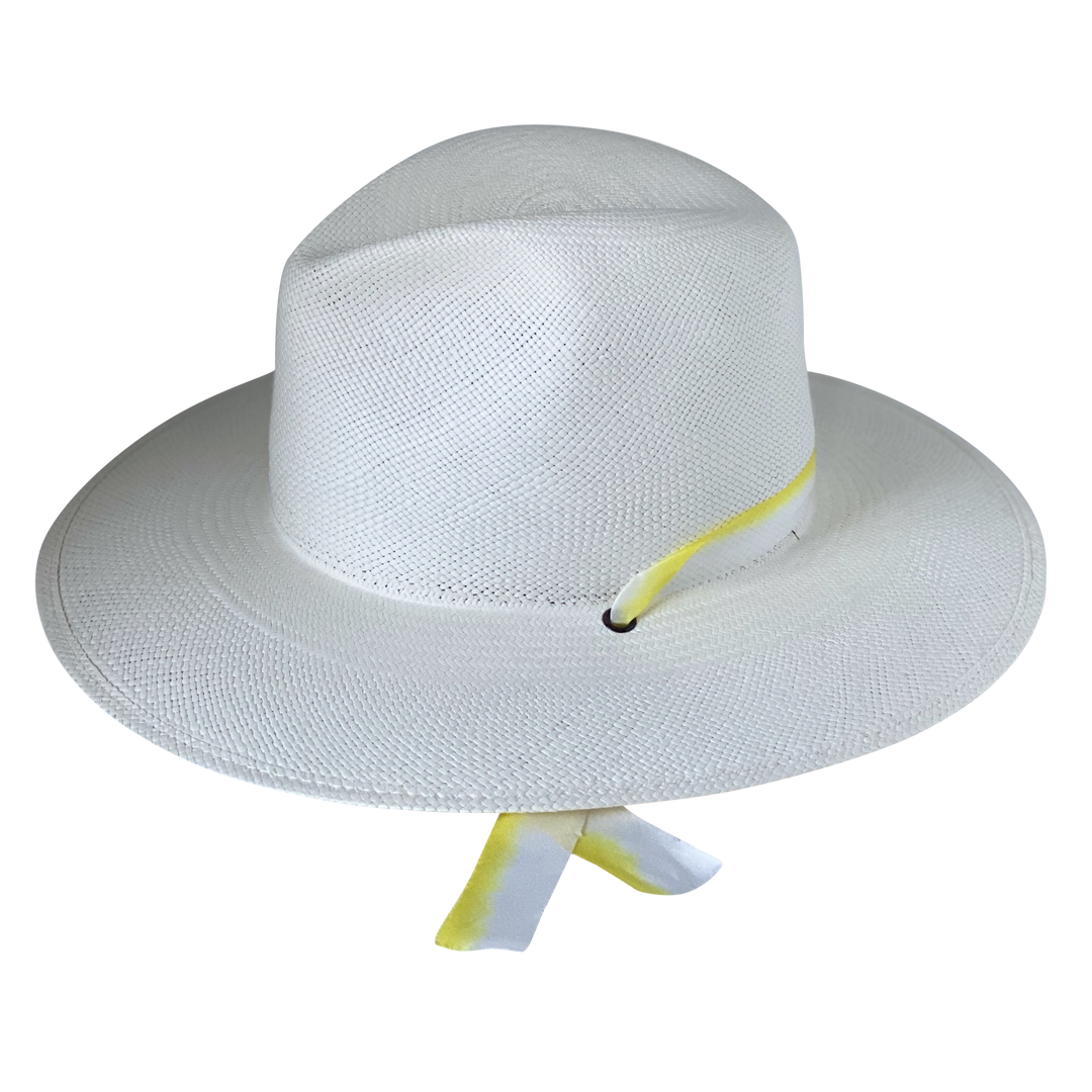 The Siena white toquilla straw wide-brim hat with yellow and white silk drop-down ribbon, right-side product cutout