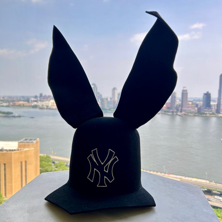 Khia Tullae The 212 Asymmetric Bunny Lid hat in black felt with New York logo and bendable ears, front view