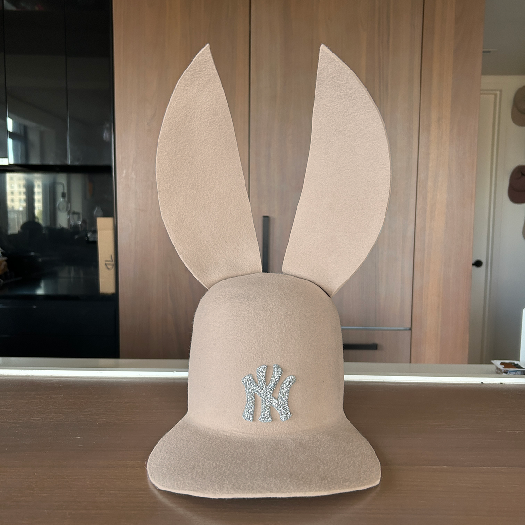Khia Tullae The 212 Embellished Bunny Lid hat in bone felt with NY patch embellished with rhinestones, front view