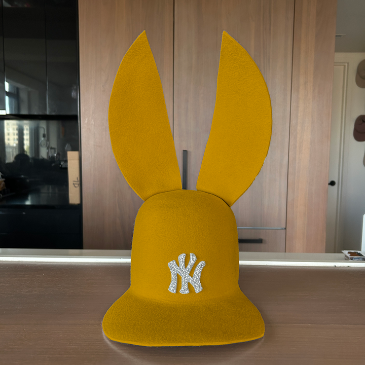 Khia Tullae The 212 Embellished Bunny Lid hat in mustard felt with NY patch embellished with rhinestones, front view