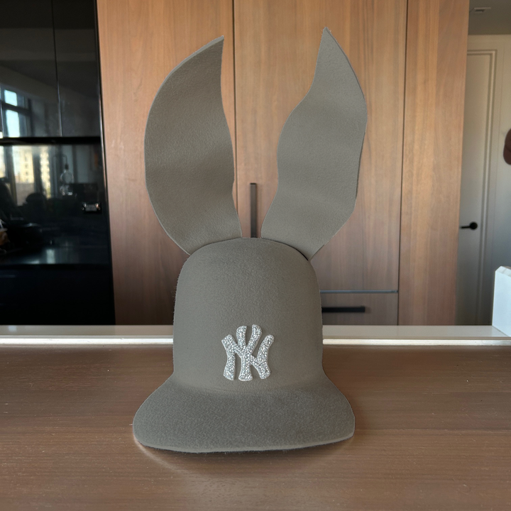 Khia Tullae The 212 Embellished Bunny Lid hat in ash grey felt with NY patch embellished with rhinestones and waved ears, front view