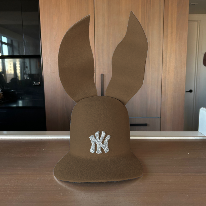 Khia Tullae The 212 Embellished Bunny Lid hat in camel felt with NY patch embellished with rhinestones and waved ears, front view