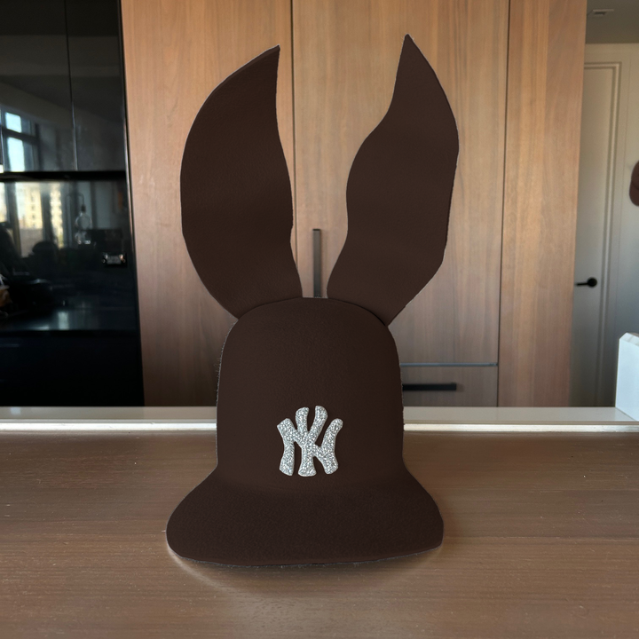 Khia Tullae The 212 Embellished Bunny Lid hat in chocolate felt with NY patch embellished with rhinestones and waved ears, front view