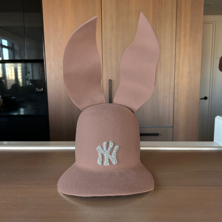 Khia Tullae The 212 Embellished Bunny Lid hat in fawn felt with NY patch embellished with rhinestones and waved ears, front view
