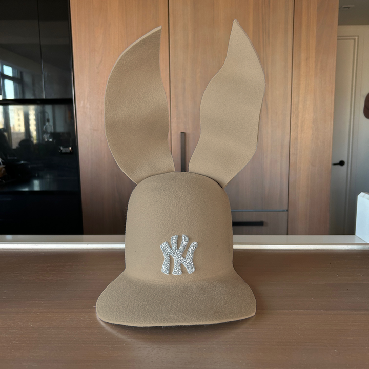 Khia Tullae The 212 Embellished Bunny Lid hat in sahara felt with NY patch embellished with rhinestones and waved ears, front view