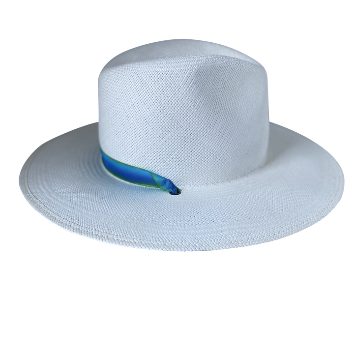 Khia Tullae The Amani white toquilla straw wide-brim hat with a blue and green tie-dye silk ribbon half band, left-side product cutout