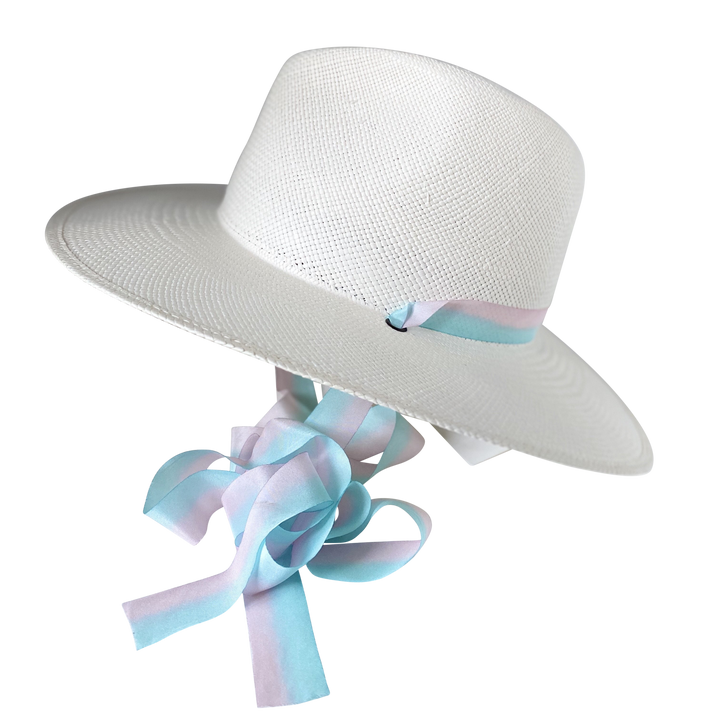 Khia Tullae The Audrey white toquilla straw wide-brim hat with pastel blue and pink silk drop-down ribbon, angled product cutout with ribbon detail