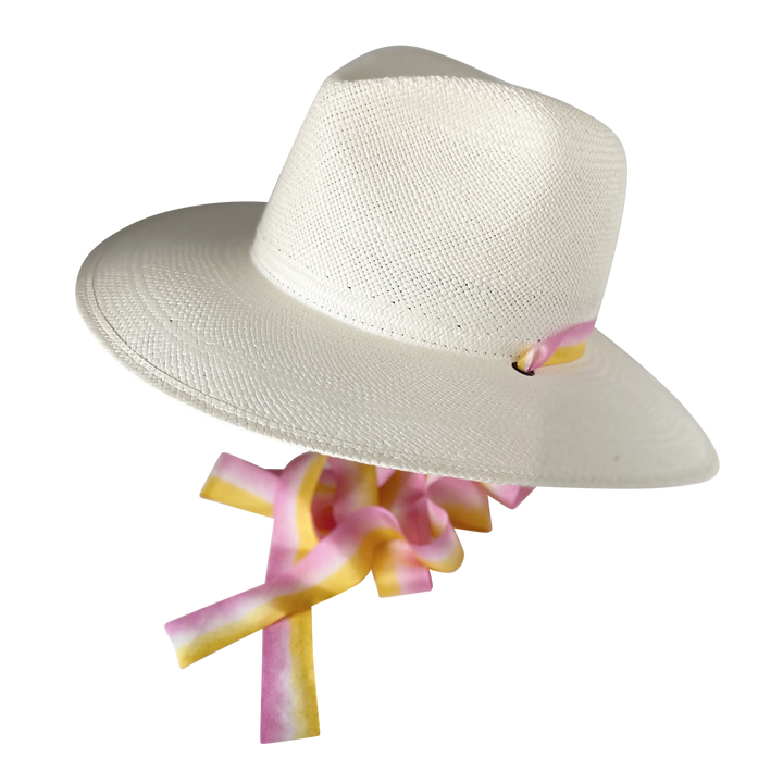 The Bailey white toquilla straw wide-brim hat with yellow and pink silk drop-down ribbon and gathered ribbon ties, side angled product cutout