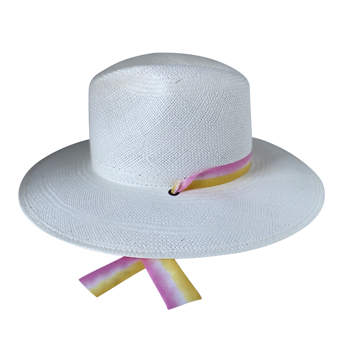 The Bailey white toquilla straw wide-brim hat with yellow and pink silk drop-down ribbon, angled right product cutout