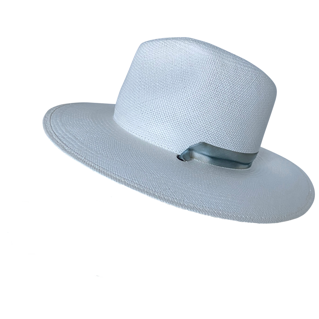 Khia Tullae The Bexley white toquilla straw wide-brim hat with a blue and grey silk ribbon half band, right-side angled product cutout 