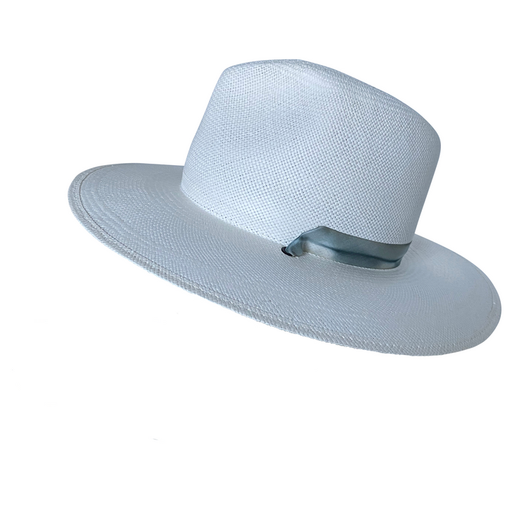 Khia Tullae The Bexley white toquilla straw wide-brim hat with a blue and grey silk ribbon half band, right-side angled product cutout 