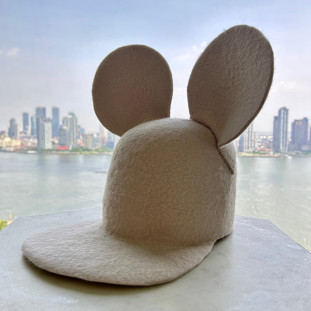 Khia Tullae The Calder Cap hat in bone felt, front angled left view