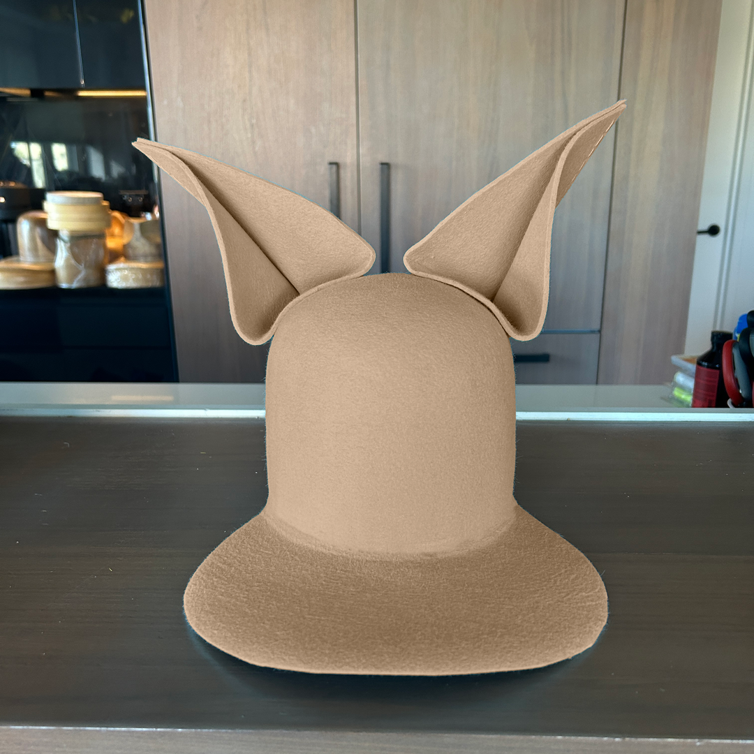 Khia Tullae The Foxy Lid hat in sahara felt with folded bunny ears, front view