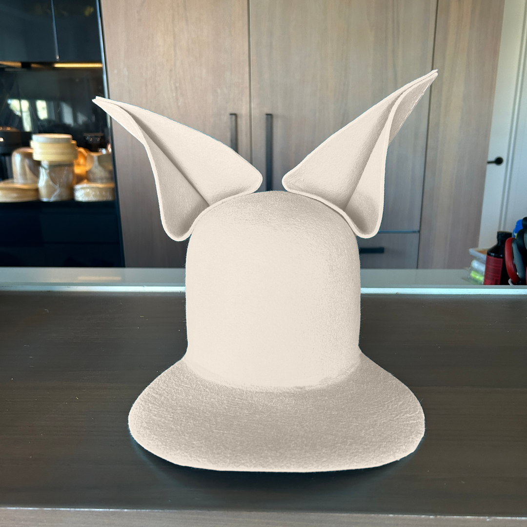 Khia Tullae The Foxy Lid hat in silver belly felt with folded bunny ears, front view