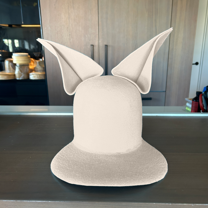 Khia Tullae The Foxy Lid hat in silver belly felt with folded bunny ears, front view