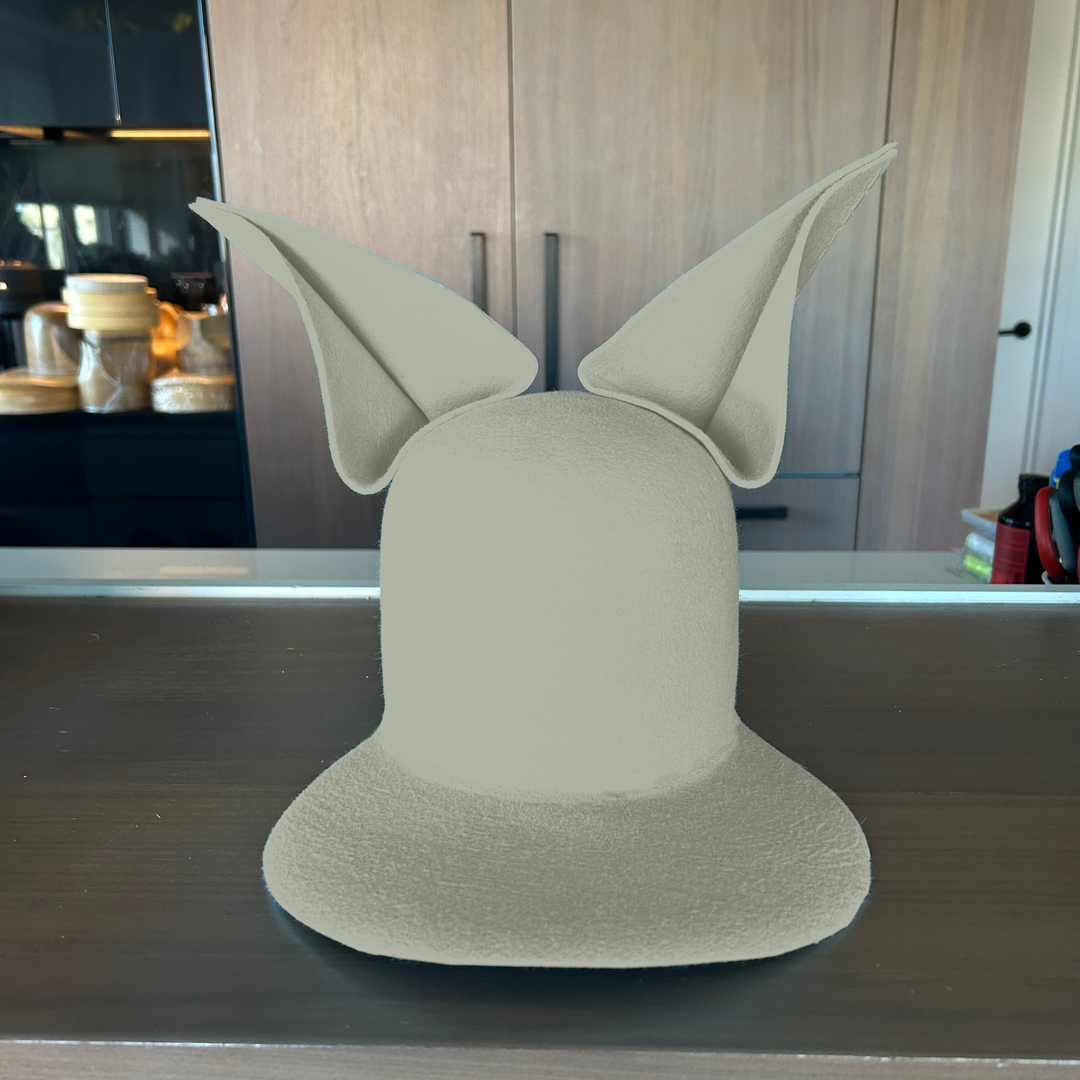 Khia Tullae The Foxy Lid hat in willow felt with folded bunny ears, front view