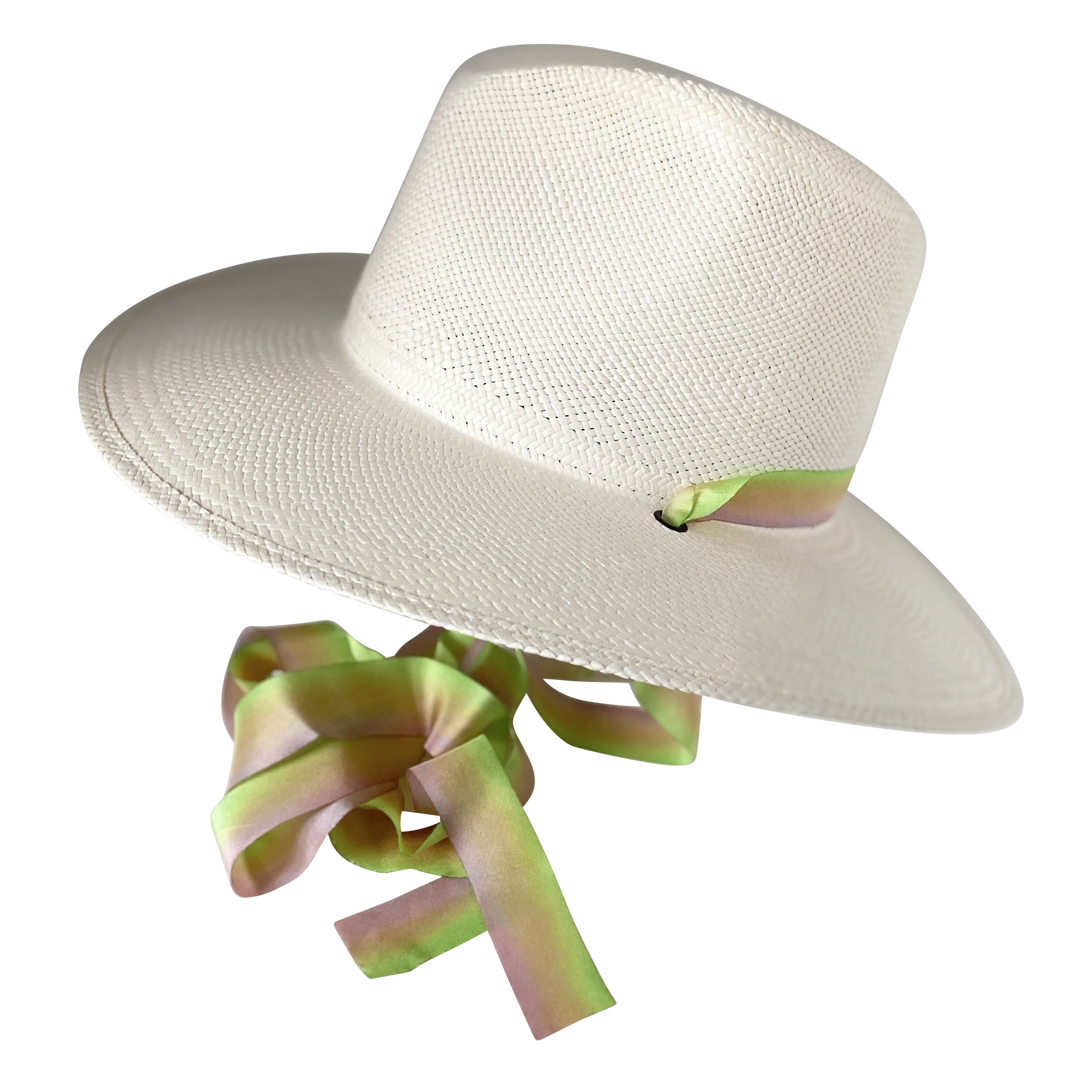 Khia Tullae The Harlow white toquilla straw wide-brim hat with neon green and pastel pink silk drop-down ribbon, angled product cutout with ribbon detail