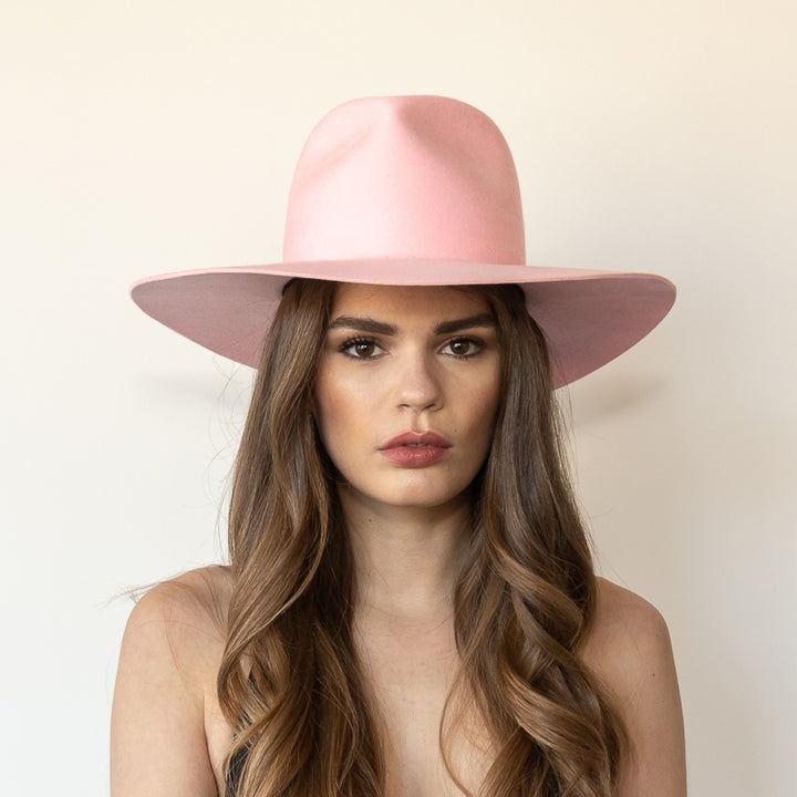 Khia Tullae The Lex pink wool wide-brim fedora, front view on model