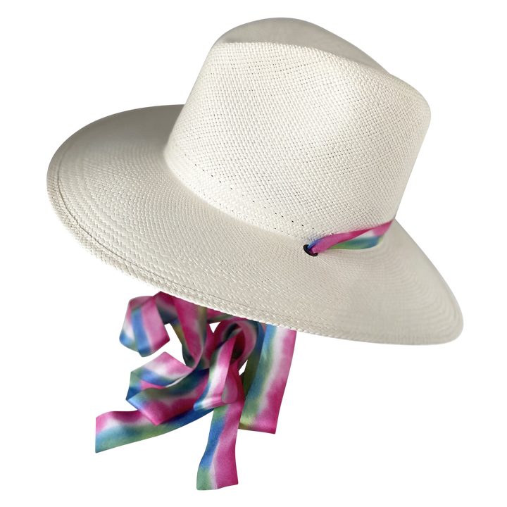 Khia Tullae The Maya white toquilla straw wide-brim hat with magenta, blue and green silk drop-down ribbon, angled product cutout with ribbon detail