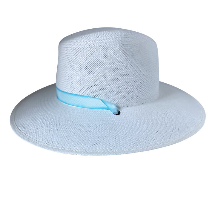 Khia Tullae The Montana white toquilla straw wide-brim hat with a pastel blue tie-dye silk ribbon half band, left-side product cutout