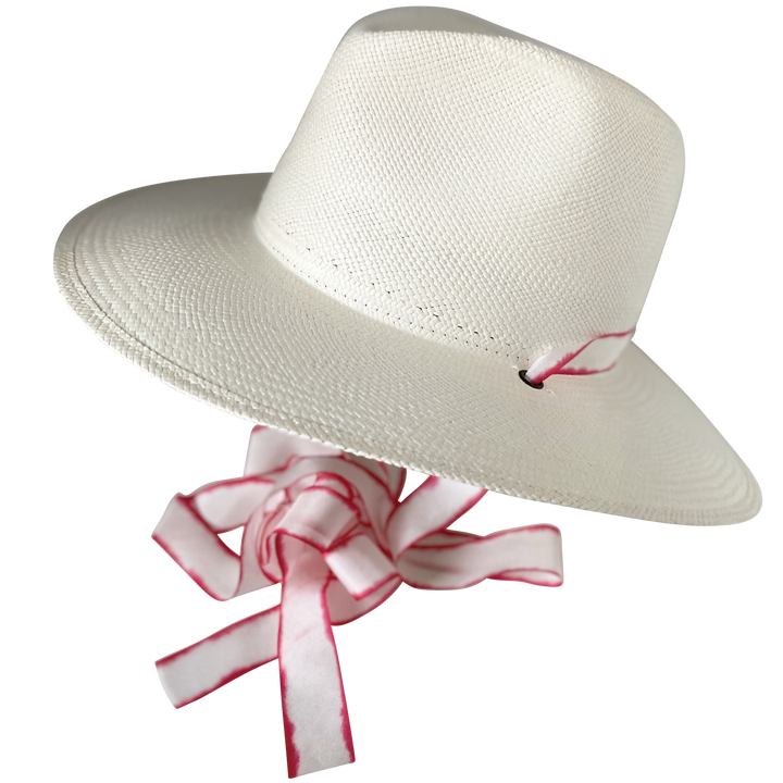 Khia Tullae The Morgan white toquilla straw wide-brim hat with red-white silk drop-down ribbon, angled product cutout with ribbon detail