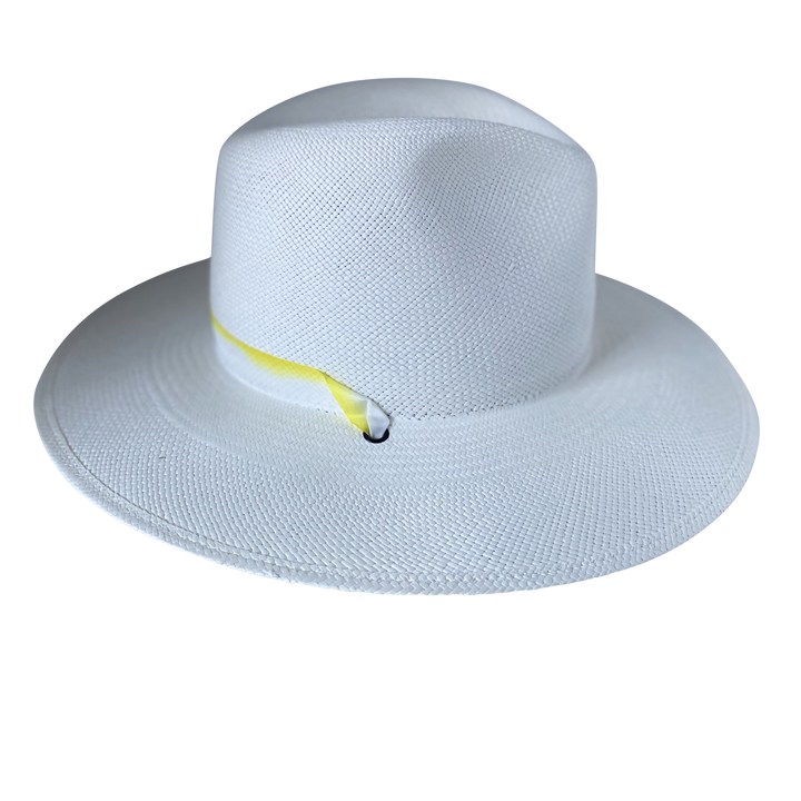 Khia Tullae The Siena white toquilla straw wide-brim hat with a pastel yellow tie-dye silk ribbon half band, left-side product cutout