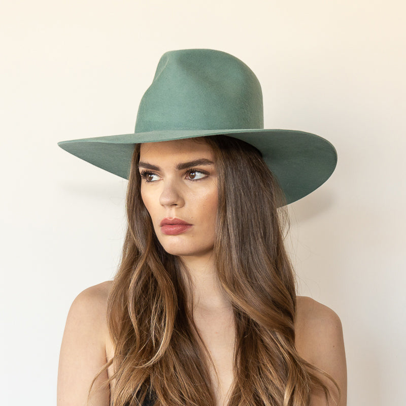 Khia Tullae The Waverly thyme wool wide-brim fedora, angled front left view on model