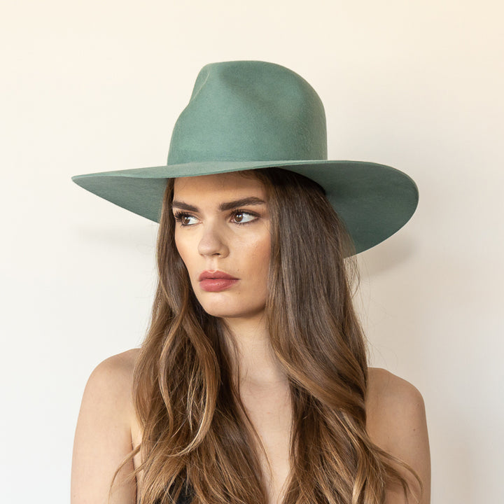 Khia Tullae The Waverly thyme wool wide-brim fedora, angled front left view on model